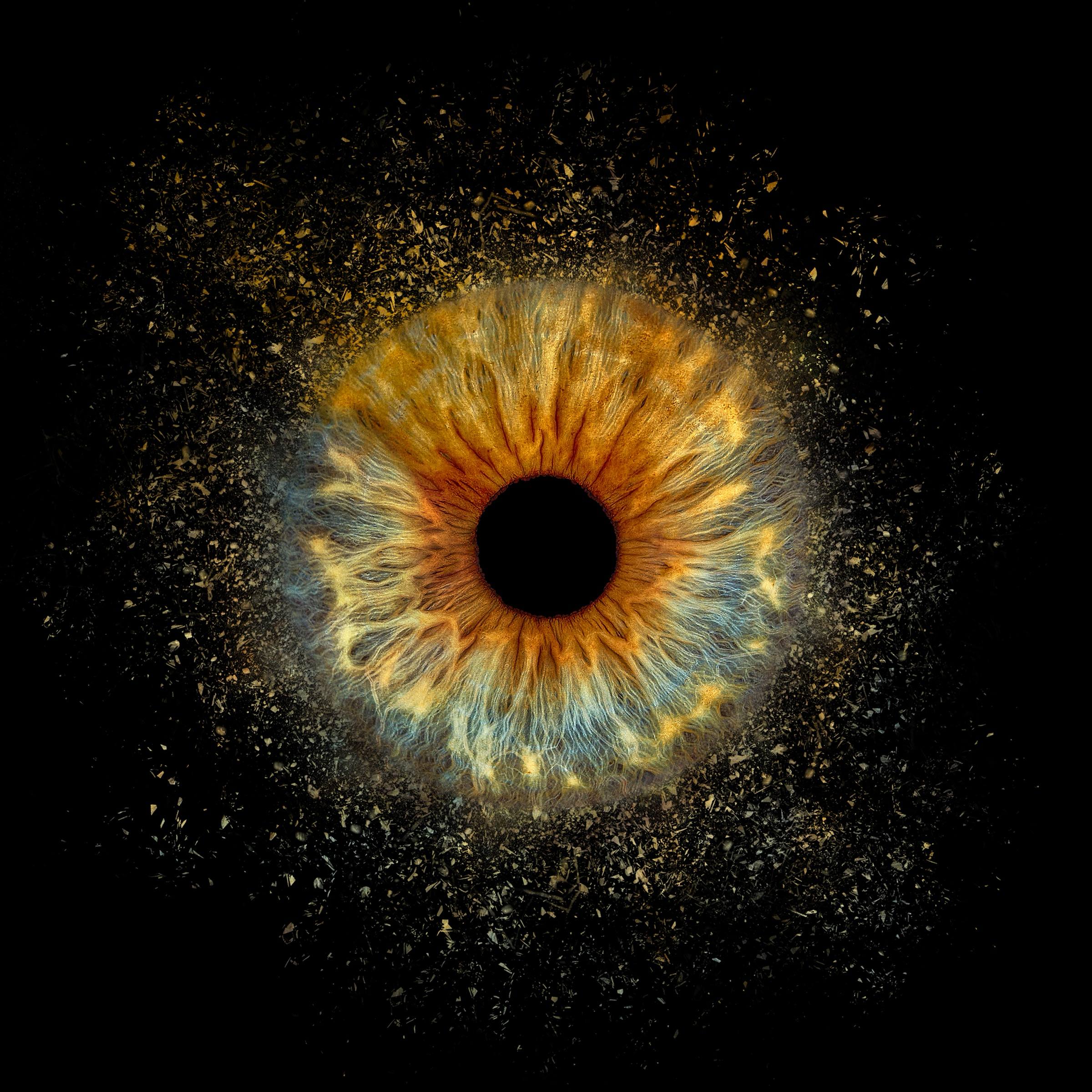 Golden iris with particle burst